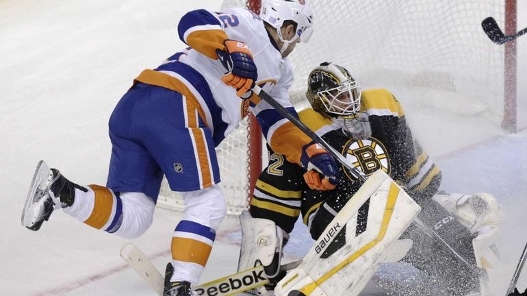 Boston Bruins goalie Niklas Svedberg makes a save as he...
