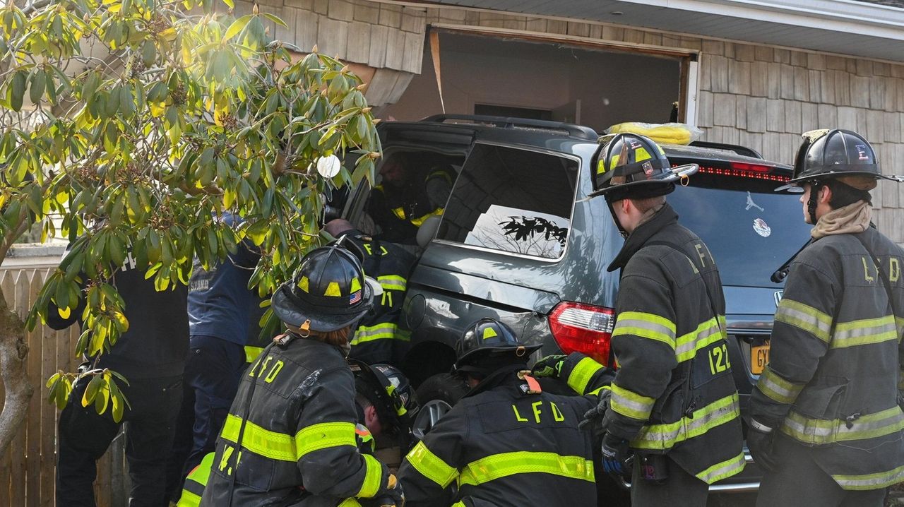 Two injured after car crashes into neighbor's house in Ronkonkoma Newsday