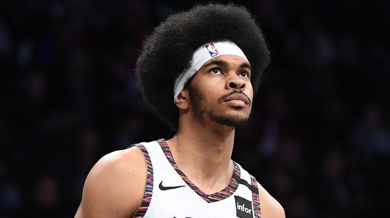 Nets center Jarrett Allen looks on in the second half...