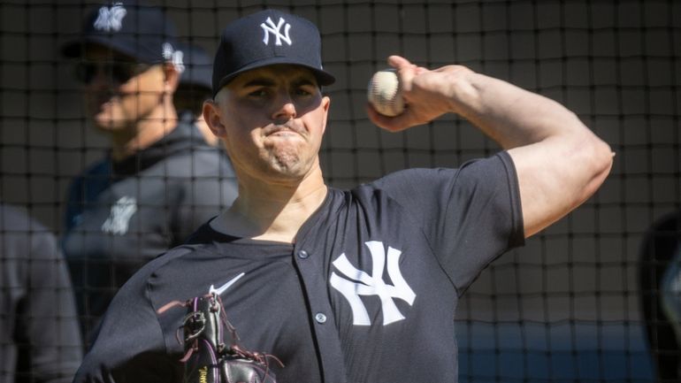 Yankees’ pitcher Carlos Rodon pitches live batting practice during spring training...