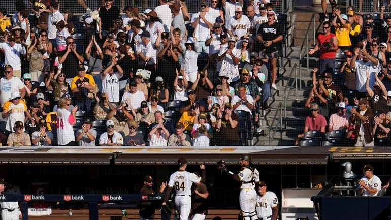 Fans applaud San Diego Padres starting pitcher Dylan Cease (84)...