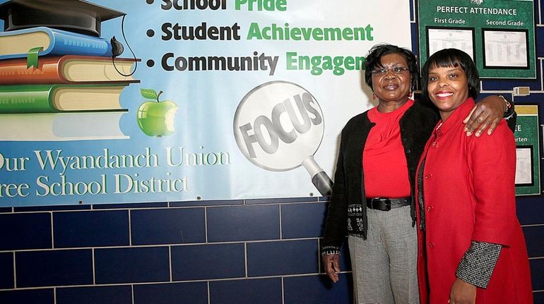 Wyandanch Superintendent Mary Jones, left, with Shamika Simpson, principal of...