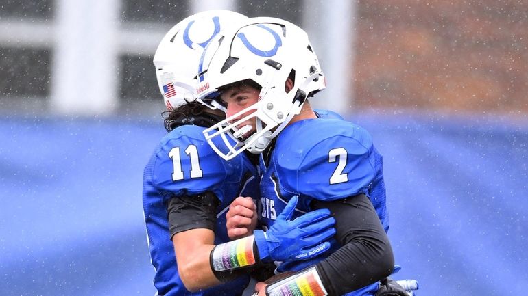 Joey Goodman of Calhoun, right, celebrates a touchdown with Joe Belbol during...