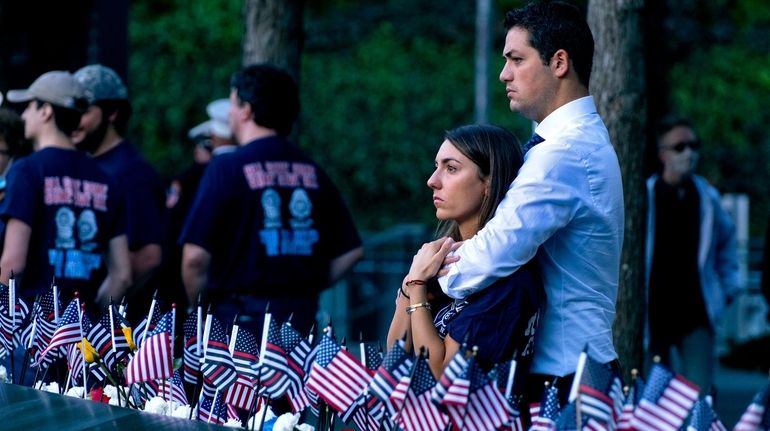 Katie Mascali is comforted by her fiance Andre Jabban as...