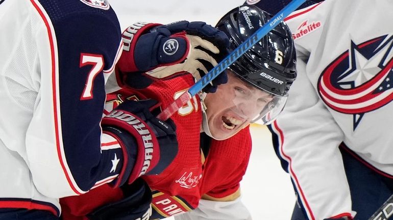 Blue Jackets center Sean Kuraly and right wing Mathieu Olivier...