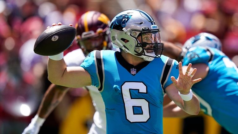 Carolina Panthers quarterback Baker Mayfield throws a pass during the...