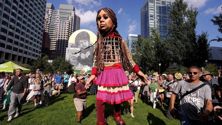 Little Amal, a 12-foot puppet of a 10-year-old Syrian refugee...