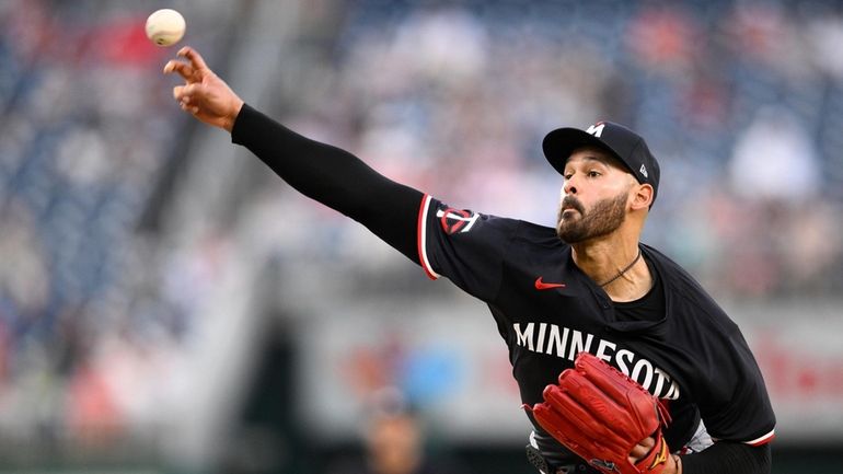 Minnesota Twins starting pitcher Pablo Lopez throws during the fourth...