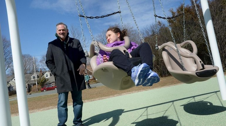 With her father, Ken Wolcott, at her side, Meri Wolcott, who uses a...