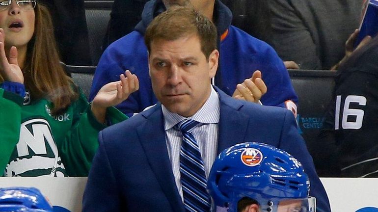 Islanders head coach Doug Weight looks on against the Hurricanes...