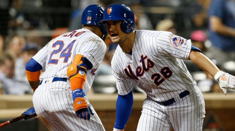 The Mets' J.D. Davis celebrates his sixth-inning home run against the...