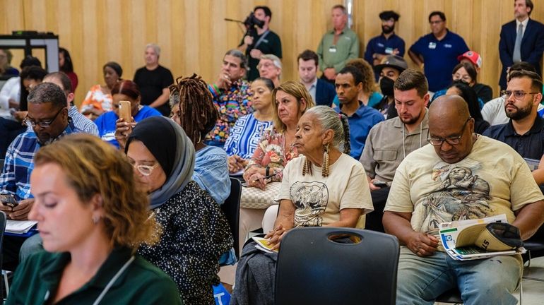 Attendees Wednesday night in Wyandanch at a meeting with officials from...