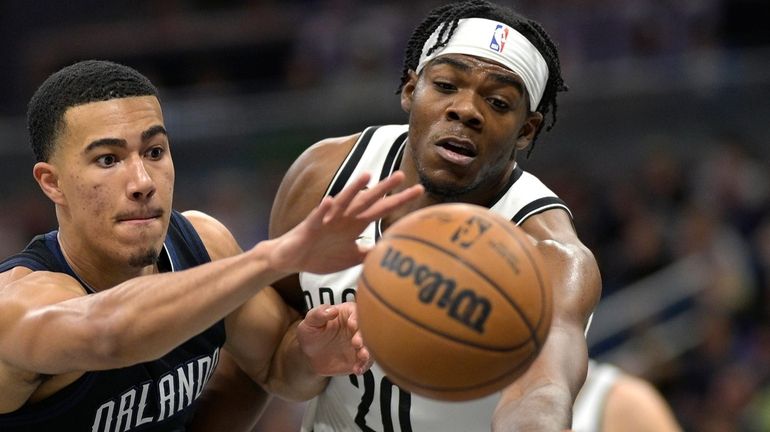 Orlando Magic guard Caleb Houstan (2) and Nets center Day'Ron...