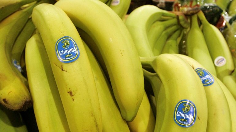 Chiquita bananas are piled on display at the Heinen's grocery...