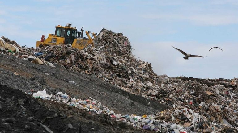 A plow is used to move waste at the Brookhaven...