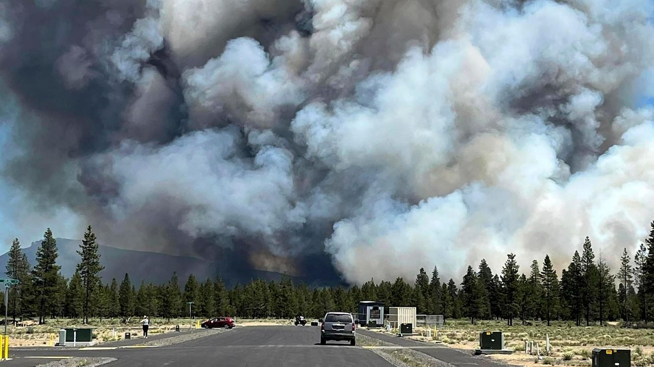 Gusty winds help spread fast growing central Oregon wildfire and prompt ...