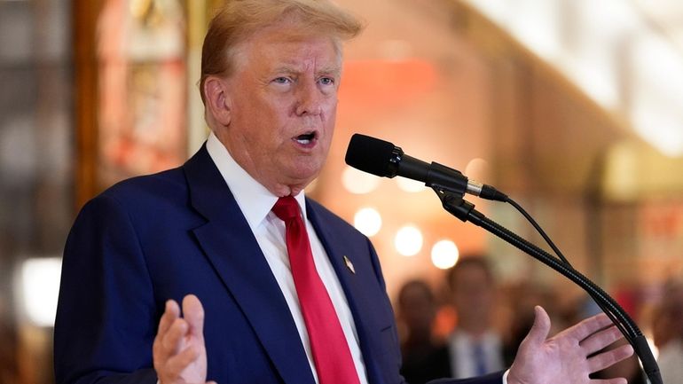 Former President Donald Trump speaks during a news conference at...