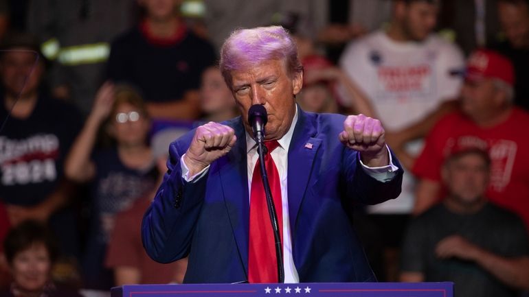 Republican presidential nominee former President Donald Trump makes a boxing...