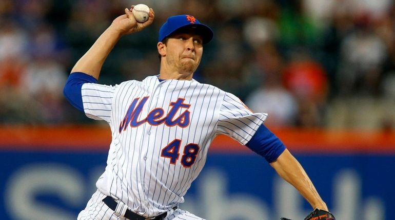 Jacob deGrom of the Mets pitches in the second inning...