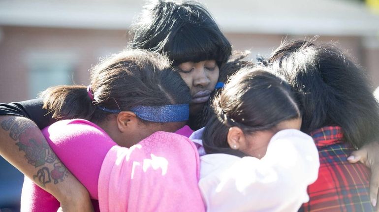 Mourners gather Friday, Oct. 23, 2015 at the Union Baptist...