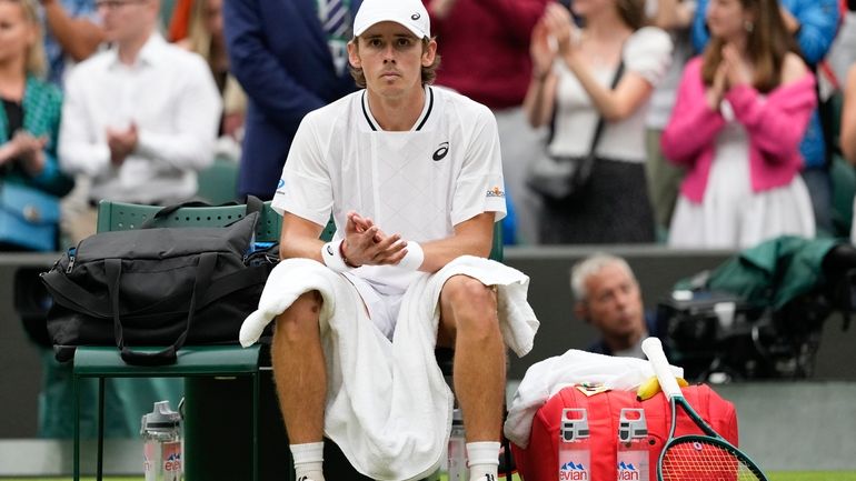 Alex de Minaur of Australia reacts following his fourth round...