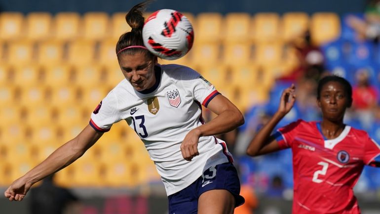 United States' Alex Morgan goes for a header during a...