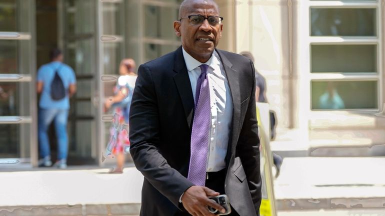 FILE — Carlos Watson leaves Brooklyn federal court, July 15,...