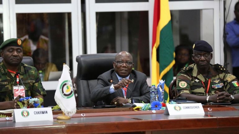 ECOWAS commissioner Abdel-Fatau Musah, centre, speaks during a press briefing...