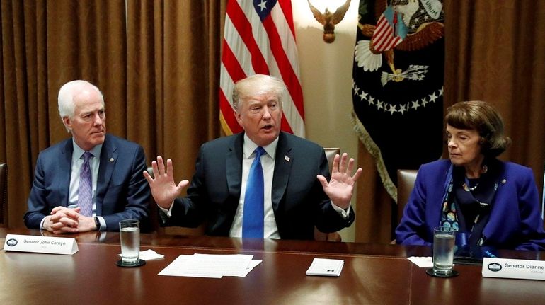 President Donald Trump speaks in the Cabinet Room of the...