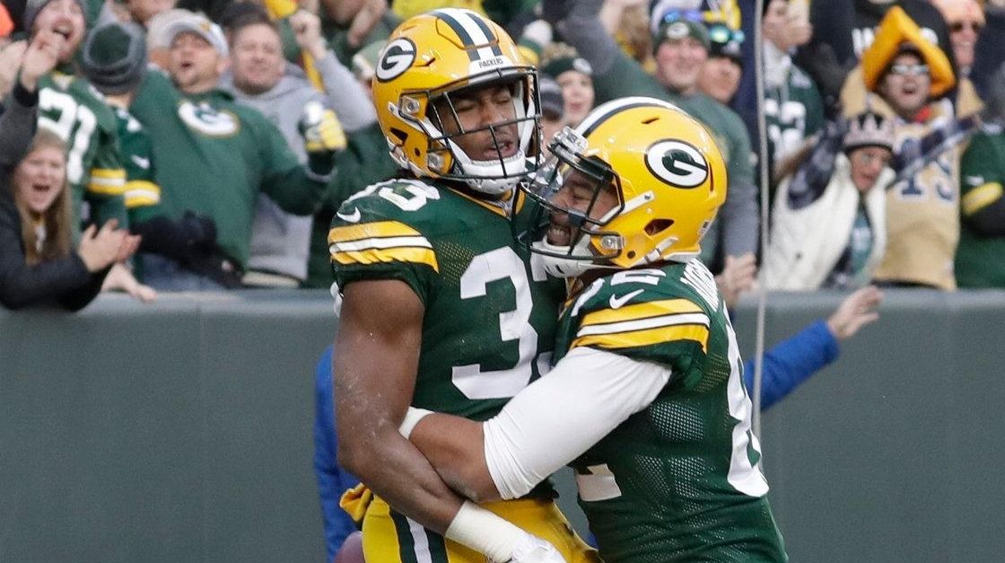 Green Bay Packers' Aaron Jones celebrates his touchdown run during