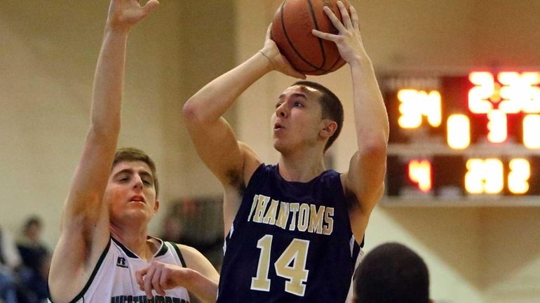 Bayport-Blue Point Doug Niblock drives the lane with the layup...