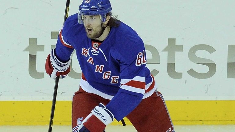 Rick Nash of the Rangers celebrates after scoring one of...