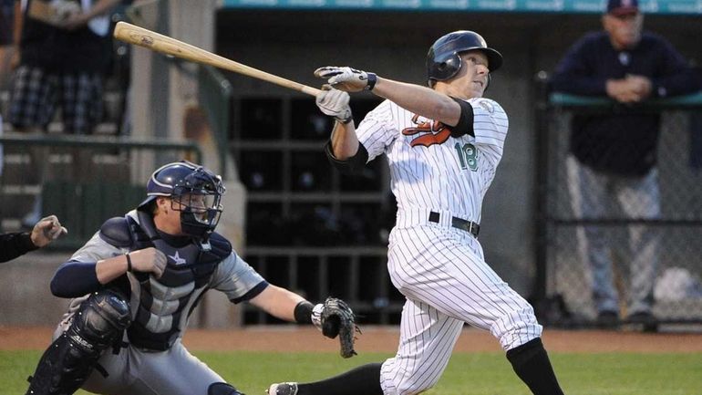 Long Island Ducks' James McOwen hits in a run in...