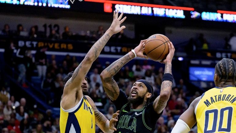 New Orleans Pelicans forward Brandon Ingram (14) shoots against Indiana...