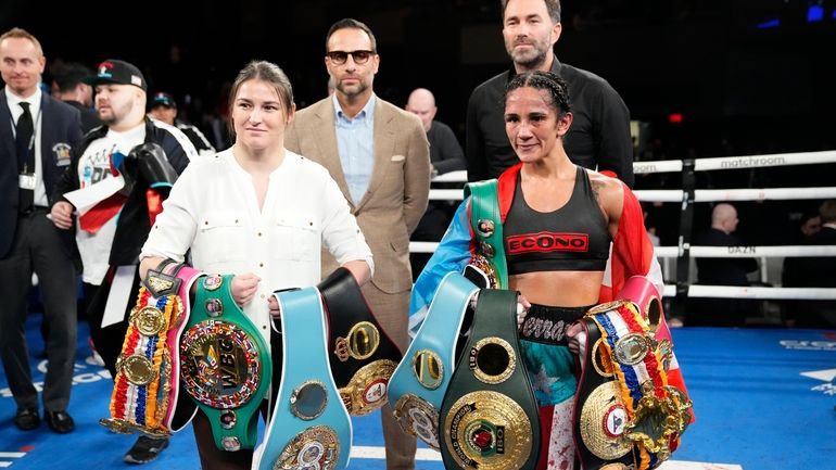 Ireland's Katie Taylor, left, poses for photographs with Puerto Rico's...