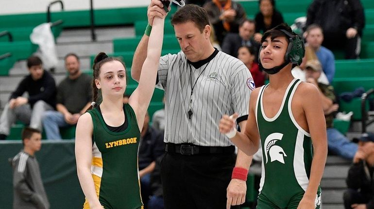 Lynbrook wrestler Ally Fitzgerald, left, was victorious in her exhibition...