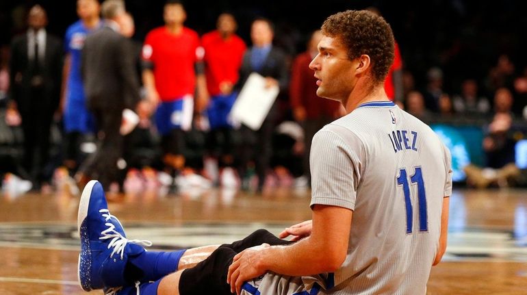 Brook Lopez #11 of the Brooklyn Nets looks on from...