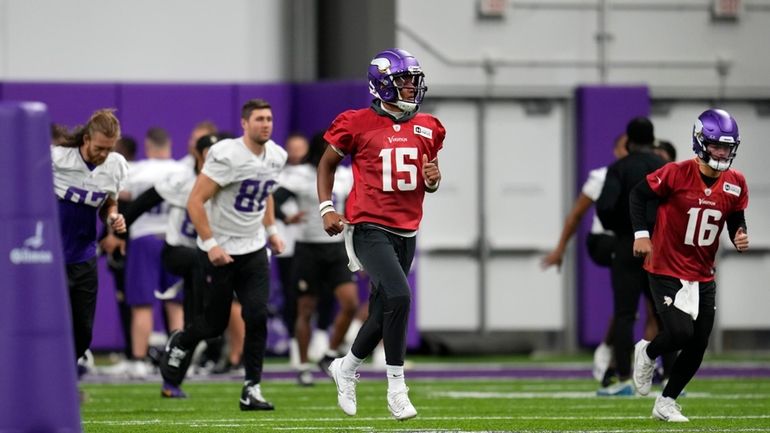 Minnesota Vikings quarterback Joshua Dobbs (15) takes part in drills...