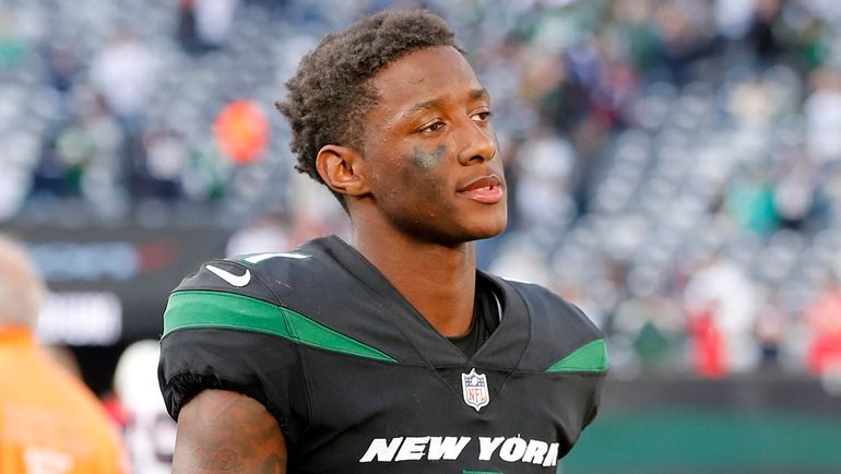 Sauce Gardner of the Jets walks off the field after a...