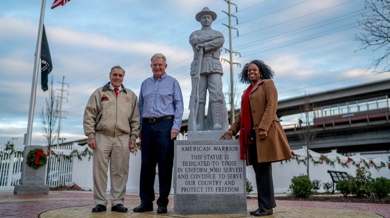 John Farina, left, in 2015 next to the "doughboy" statue...