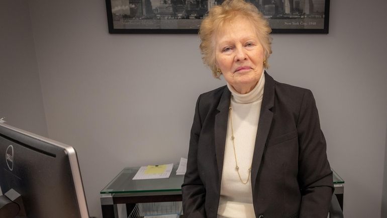 Mary Jane Tucker, 85, at her desk in Melville.