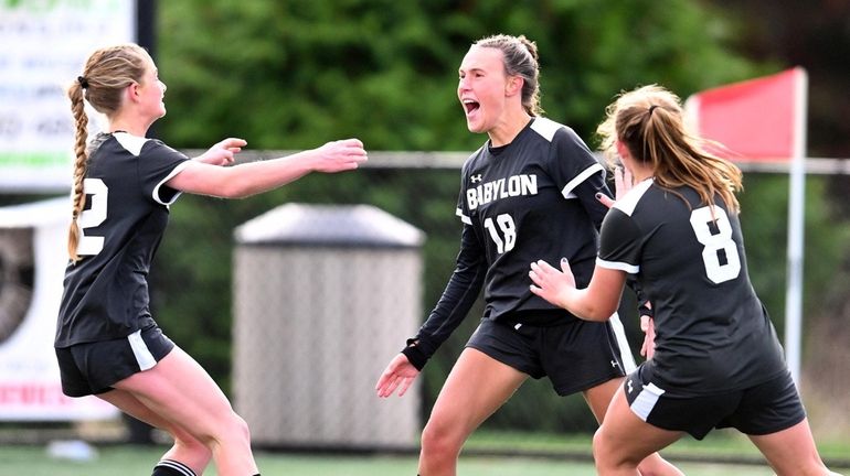 Grace Varley (18) of Babylon celebrates her game winning goal...