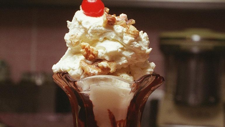 A hot fudge sundae at Itgen's Ice Cream Parlor in...