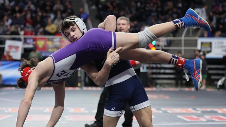 Matt Marlow of Northport wrestles Trey LeChase of Fairport in...