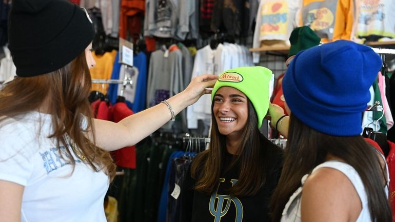 Max & Gino’s Clothing Co. employee Sydney Irwin, 19, of...