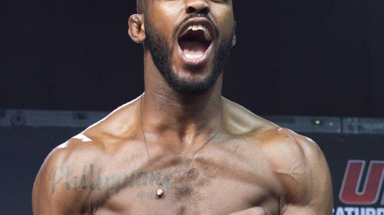 Jon Jones yells on stage after the weigh in for...