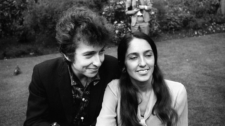  Bob Dylan and Joan Baez are seen in the gardens...