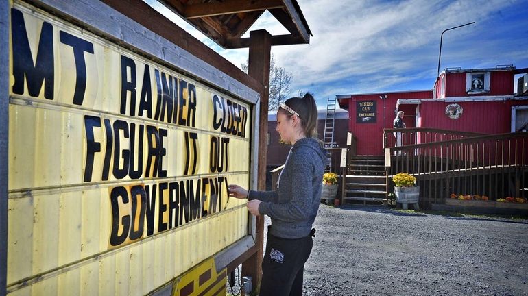 Abigail Johnstad, 18, adds a new message Tuesday to a...