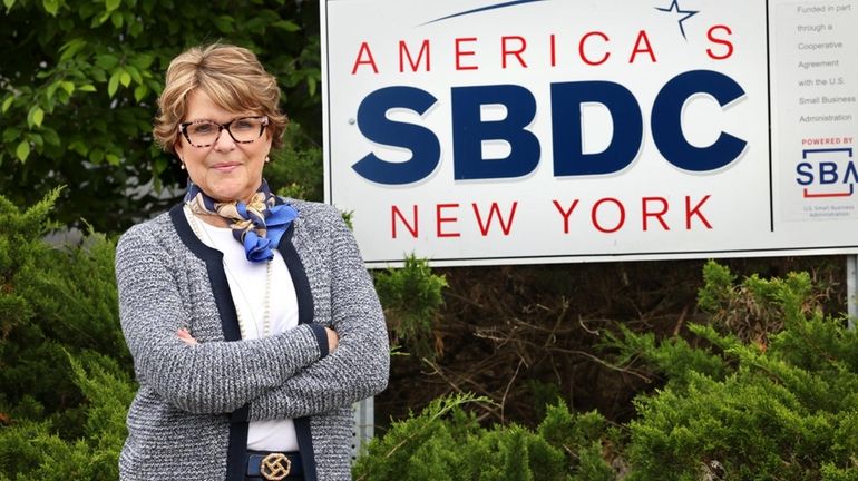 Martha M. Stansbury is outside the Small Business Development Center office...