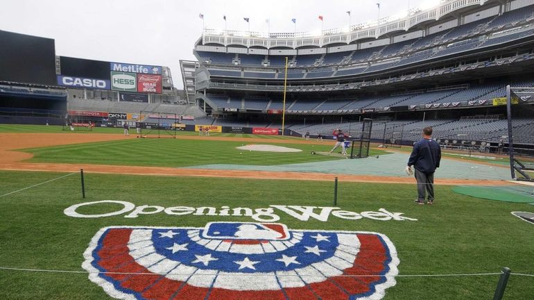 A painted ceremonial bunting adorns the grass in third base...